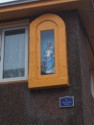 Virgin Mary shrine on a building